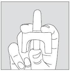 A hand firmly gripping a cylindrical medical device with an arched base for drug administration