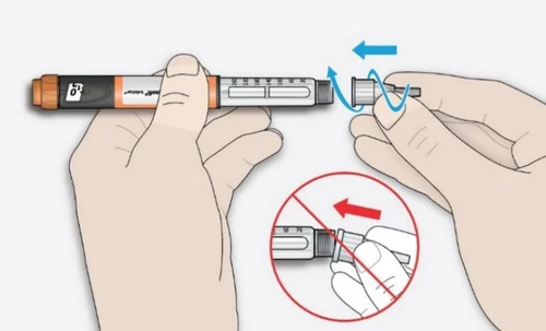 Dos manos sostienen una pluma inyectable para montar la