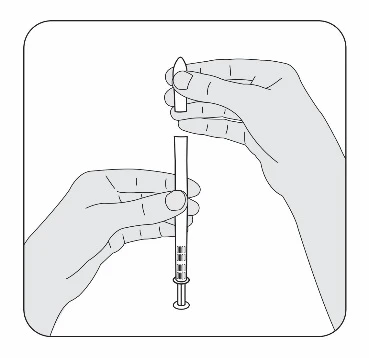 Two hands removing a protective cap from a pre-filled syringe to prepare the