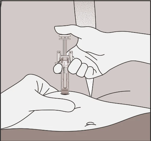 A hand holding a vertical injector pen while the