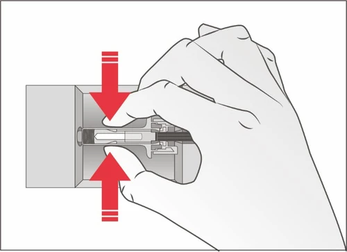 A hand pressing with fingers on the top and bottom of a medical device with two red arrows indicating downward movement