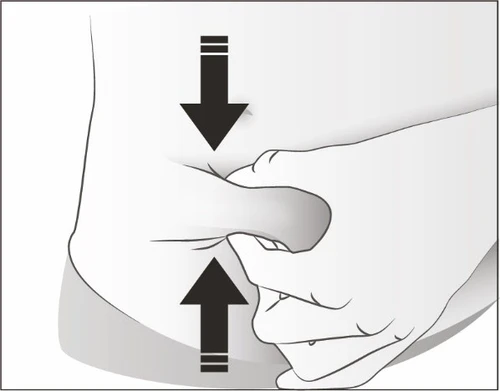 A hand pinching the skin of the