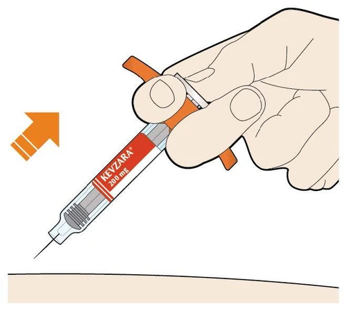 A hand holding a pre-filled Kevzara 200 mg syringe ready for