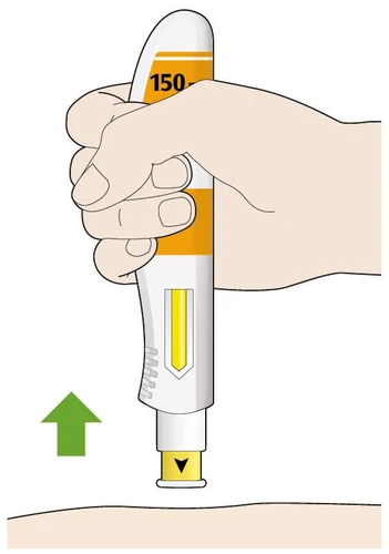A hand holding a white and yellow medical device with a green arrow pointing toward the