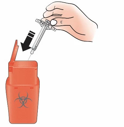 A hand inserting a syringe with needle into the