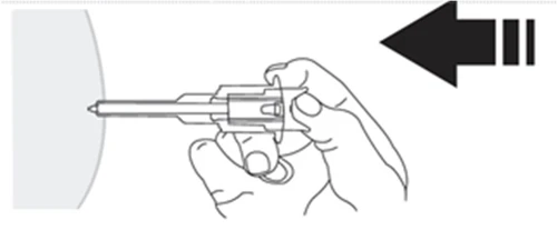 A hand holding a medical device for injection