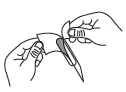 Two hands carefully opening a package or plastic wrapper to remove the internal contents