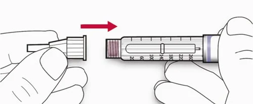 Two hands separating a protective cap from the body of a graduated syringe, with a red arrow indicating the detachment motion