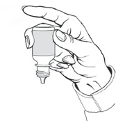 A hand holds a dropper bottle vertically with the cap removed and the nozzle pointing downward