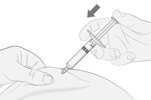 A hand holds an angled syringe inserting it into the body's skin while the