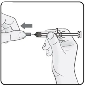 Two hands preparing a syringe with needle, one hand holding the syringe barrel and the