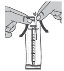 Two hands inserting a needle into a graduated syringe
