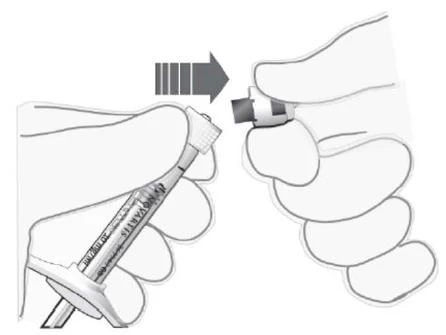 Two hands separating components of a Novartis injection pen via a horizontal pulling motion indicated by an arrow
