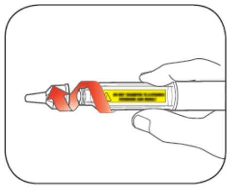 A hand holding an injection pen while a red arrow indicates rotational movement to unscrew or rotate the terminal part of the device