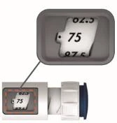 Dettaglio ravvicinato di un display digitale su un dispositivo medico che mostra i numeri 62.5, 75 e 87.5 su sfondo bianco