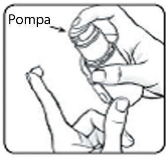 A hand holding a small cylindrical pump with an arrow indicating the device above the fingers of a