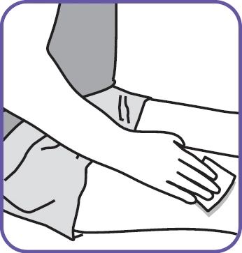 An outstretched arm being cleaned with a white cloth or gauze to prepare the skin for drug administration