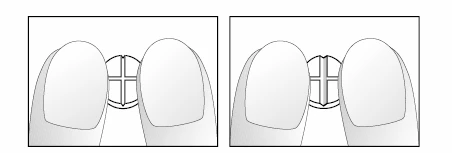 Two fingers holding a small cylindrical object with a cross engraved on the top, shown in two distinct stages