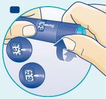 Two hands hold a blue medical device with dosage indicators showing values 0.7 mg and 2.9–3.0 mg on separate circles