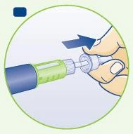 A hand inserts a cylindrical green and blue medical device into a white holder with a blue arrow indicating a rightward movement