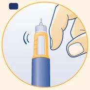 A hand holds a blue and orange injection pen vibrating as it is being prepared for use