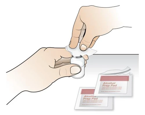 Two hands opening a white vial next to two packets of alcohol wipes for skin preparation