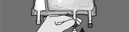 A hand grasping and rotating the bottom part of a medical vial connected to a device for