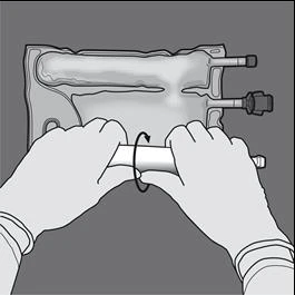 Two gloved hands holding and rotating a cylindrical device connected to an infusion bag with tubes and connectors