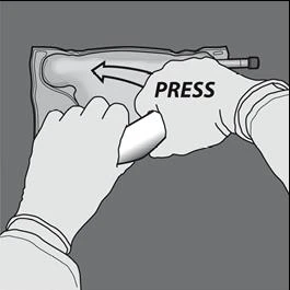 Two hands gripping a horizontal medical device with the label PRESS, indicating to press the upper part toward the