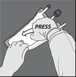 Two hands forcefully pressing the center of a white pouch containing two vials with black caps and white tubes