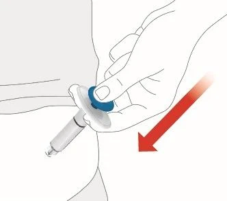 A hand holding a medical device with a blue button for injection