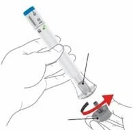 A hand holding a transparent injection pen while the