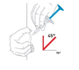 Technical drawing showing two hands holding a medical device angled at 45 degrees to the skin with directional indication