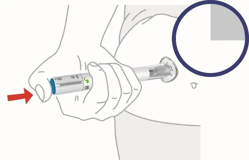 A hand holding an injection pen pressed against the skin of the