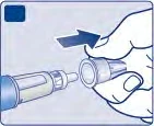 A hand holds a cap while the
