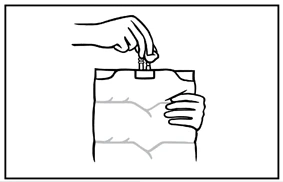 A hand pressing a medical device against the upper part of