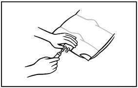 Line drawing showing two hands handling a syringe and a medicine vial for dose preparation