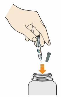 A hand holding an injection pen above the