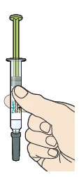 A hand holding a transparent syringe vertically with liquid inside