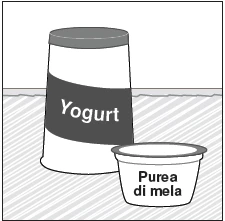 A tall yogurt container with a dark label next to a small bowl containing apple puree on a diagonally striped surface