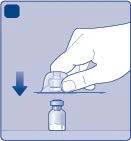 A hand pressing a protective cap downward over a small glass vial to open or seal it