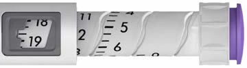 Detail of a medical device with a graduated scale numbered from 11 to 19 and a visual indicator on a white and gray background with a purple cap