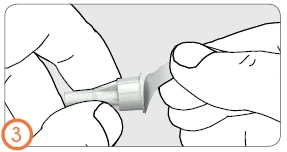 Two hands holding and separating a white medical device with a protective cap on a light gray background with the number three in an orange circle