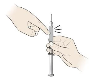 A hand holding a syringe vertically while another hand...