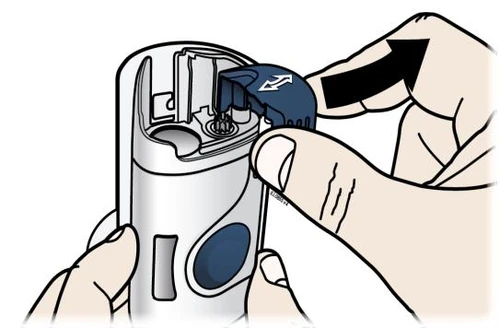 A hand holding a white medical device while another...