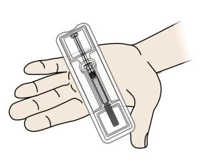 A hand holding a pre-filled syringe with needle inside a transparent blister for drug administration