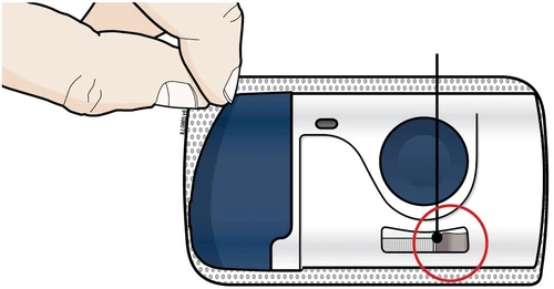 A hand holding a white and blue medical device with a vertical black line and a red circle highlighting a small gray window