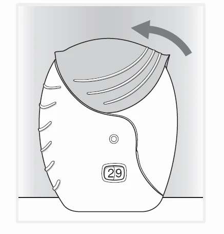 Disegno tecnico di un dispositivo medico bianco con un contatore digitale che segna 29 e una freccia curva che indica il movimento verso l'alto