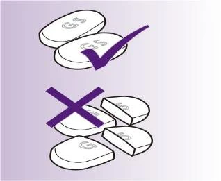 Disegno di due compresse intere con segno di spunta viola e compresse spezzate con una grande croce viola su sfondo lilla
