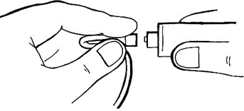 A hand holding a medical device while the